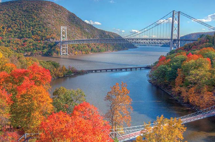 The Bear Mountain Bridge spanning the Hudson River between hills in bright fall color